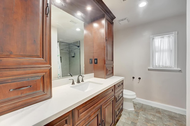 bathroom featuring toilet, baseboards, visible vents, walk in shower, and vanity