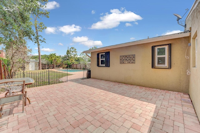 view of patio with a fenced in pool and a fenced backyard