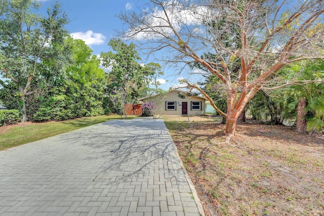 view of front of house featuring driveway and stucco siding