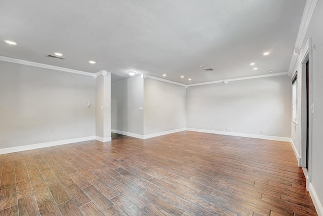 unfurnished room with baseboards, visible vents, recessed lighting, and crown molding