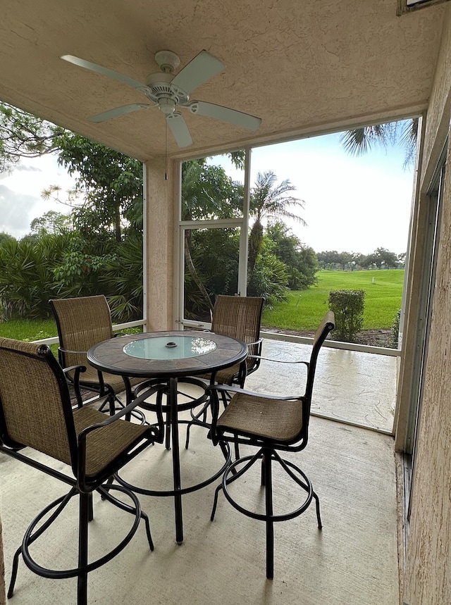 9851 Perfect Dr Unit 151, Port Saint Lucie, FL 34986 - sunroom with outdoor dining area and ceiling fan