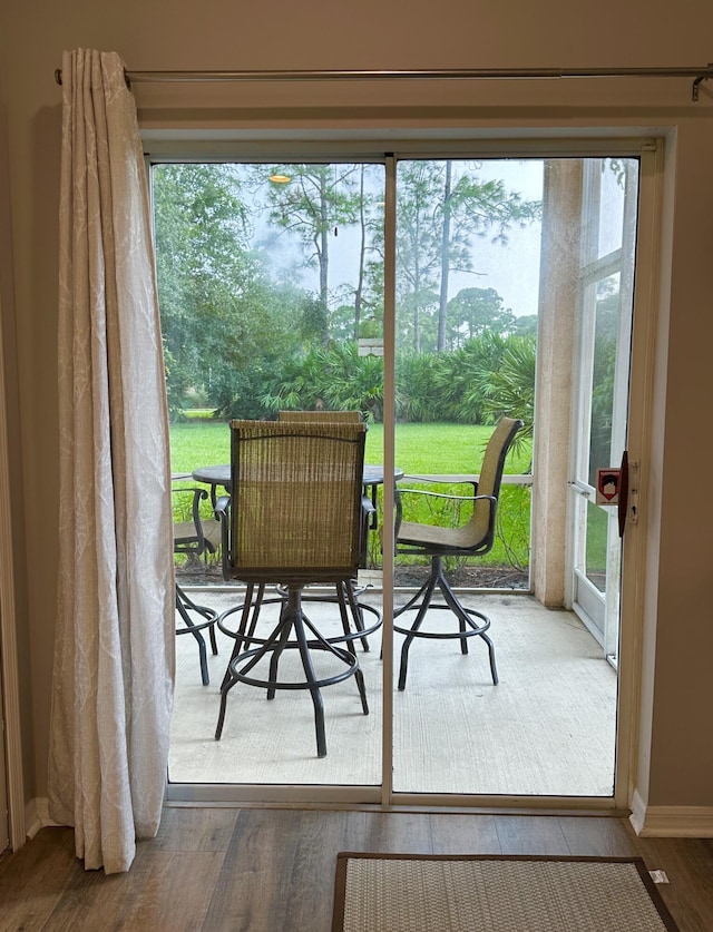 9851 Perfect Dr Unit 151, Port Saint Lucie, FL 34986 - doorway to outside featuring wood finished floors and plenty of natural light