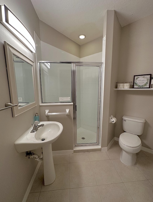 9851 Perfect Dr Unit 151, Port Saint Lucie, FL 34986 - bathroom featuring tile patterned floors, a stall shower, a textured ceiling, and recessed lighting