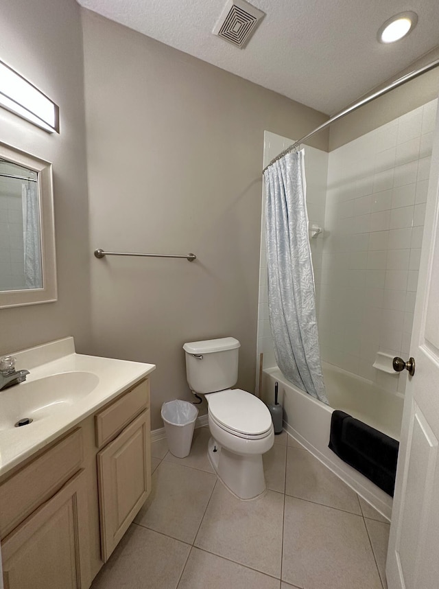 9851 Perfect Dr Unit 151, Port Saint Lucie, FL 34986 - bathroom with vanity, shower / tub combo with curtain, tile patterned floors, and a textured ceiling