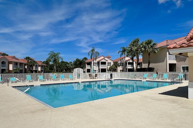 9851 Perfect Dr Unit 151, Port Saint Lucie, FL 34986 - community pool with a patio area and a residential view