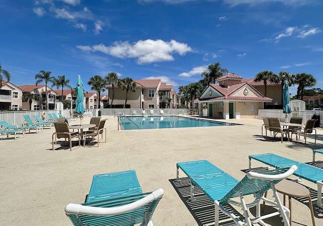 9851 Perfect Dr Unit 151, Port Saint Lucie, FL 34986 - community pool with a patio and a residential view