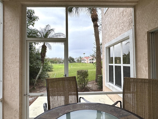 9851 Perfect Dr Unit 151, Port Saint Lucie, FL 34986 - sunroom with outdoor dining space