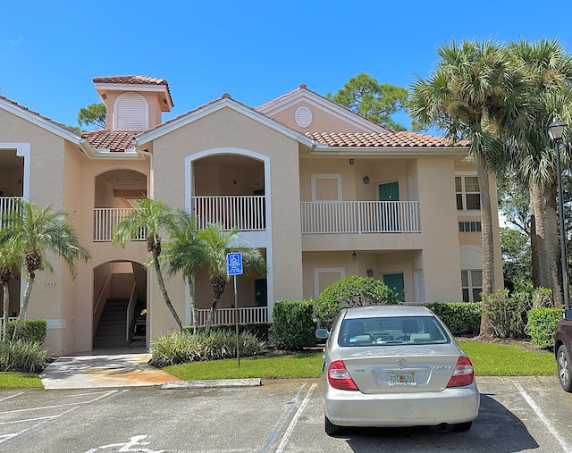 9851 Perfect Dr Unit 151, Port Saint Lucie, FL 34986 - view of property featuring uncovered parking