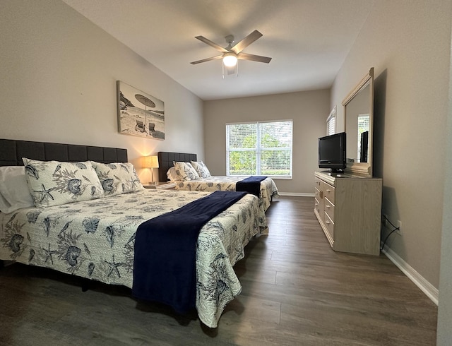 9851 Perfect Dr Unit 151, Port Saint Lucie, FL 34986 - bedroom with dark wood-style flooring and ceiling fan