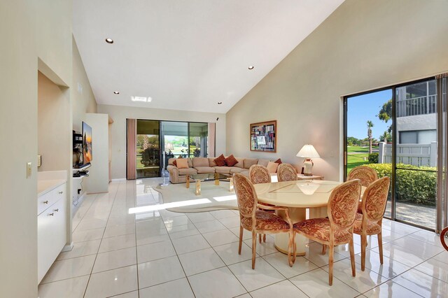 45 Eastgate Dr Unit B, Boynton Beach, FL 33436 - dining space with light tile patterned floors, baseboards, and a high ceiling