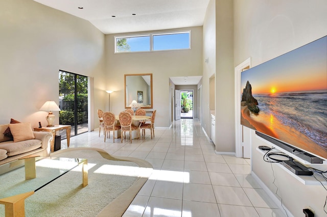 45 Eastgate Dr Unit B, Boynton Beach, FL 33436 - living room with light tile patterned floors, visible vents, a high ceiling, and baseboards