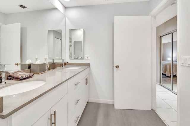 45 Eastgate Dr Unit B, Boynton Beach, FL 33436 - full bathroom with vanity, baseboards, a stall shower, tile patterned flooring, and toilet