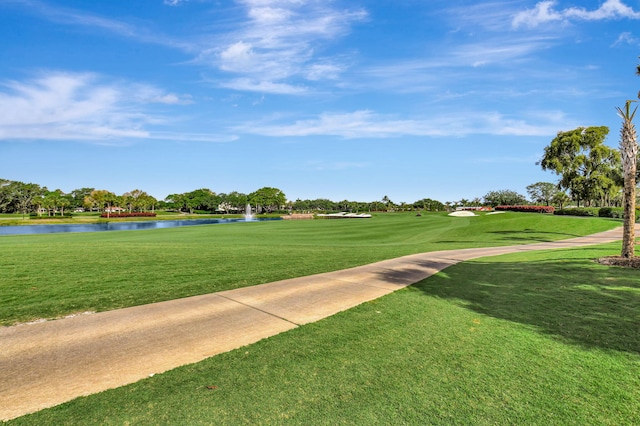 45 Eastgate Dr Unit B, Boynton Beach, FL 33436 - view of community featuring a yard, view of golf course, and a water view
