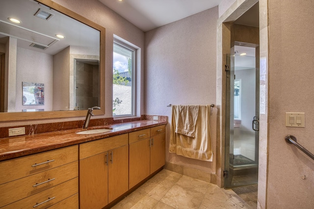1440 Breakers W Blvd, West Palm Beach, FL 33411 - full bathroom featuring a textured wall, a stall shower, and vanity
