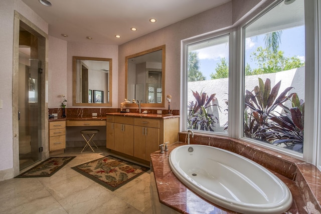 1440 Breakers W Blvd, West Palm Beach, FL 33411 - bathroom featuring plenty of natural light, a bath, vanity, and recessed lighting