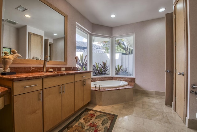 1440 Breakers W Blvd, West Palm Beach, FL 33411 - bathroom featuring a bath, vanity, baseboards, and recessed lighting