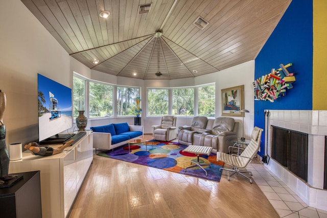 1440 Breakers W Blvd, West Palm Beach, FL 33411 - living room with a tiled fireplace and plenty of natural light