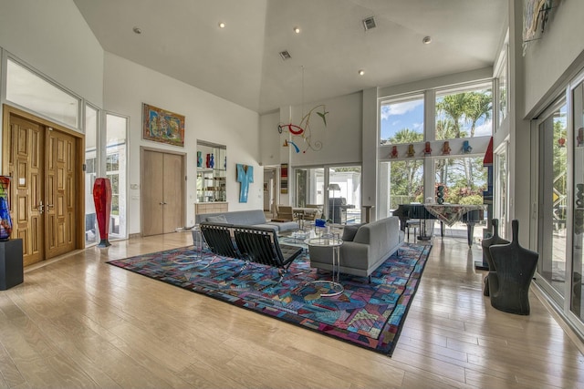 1440 Breakers W Blvd, West Palm Beach, FL 33411 - living area with high vaulted ceiling, hardwood / wood-style floors, and recessed lighting
