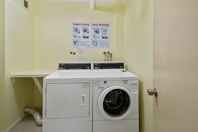 3215 S Ocean Blvd Unit 707, Highland Beach, FL 33487 - laundry area with separate washer and dryer, baseboards, and tile patterned floors