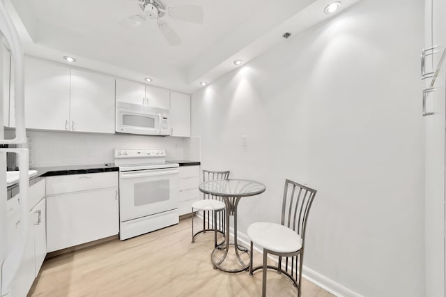 3215 S Ocean Blvd Unit 707, Highland Beach, FL 33487 - kitchen featuring white appliances, recessed lighting, dark countertops, ceiling fan, and white cabinets