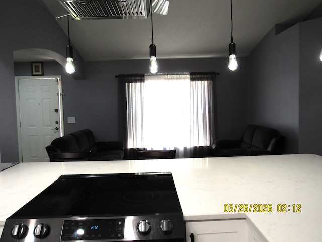 443 SW Homeland Rd, Port Saint Lucie, FL 34953 - kitchen featuring visible vents, vaulted ceiling, stainless steel electric stove, and open floor plan