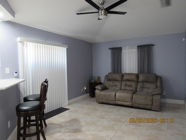 443 SW Homeland Rd, Port Saint Lucie, FL 34953 - living area featuring lofted ceiling, light tile patterned floors, baseboards, visible vents, and ceiling fan