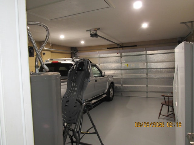 443 SW Homeland Rd, Port Saint Lucie, FL 34953 - garage with freestanding refrigerator and a garage door opener