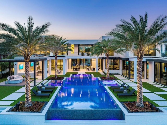 372 E Alexander Palm Rd, Boca Raton, FL 33432 - view of pool with an infinity pool and a patio