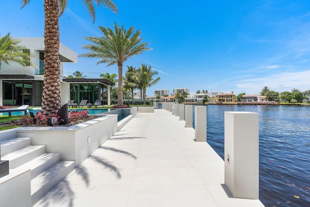 372 E Alexander Palm Rd, Boca Raton, FL 33432 - dock area with a water view and an outdoor pool