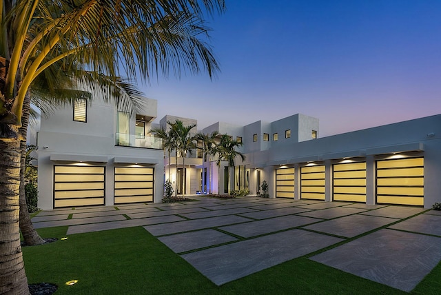 372 E Alexander Palm Rd, Boca Raton, FL 33432 - exterior space featuring an attached garage, stucco siding, and a balcony