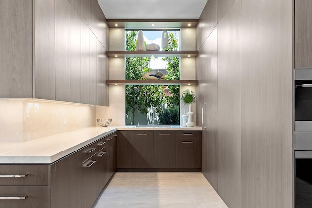 372 E Alexander Palm Rd, Boca Raton, FL 33432 - bar featuring a sink, oven, and decorative backsplash