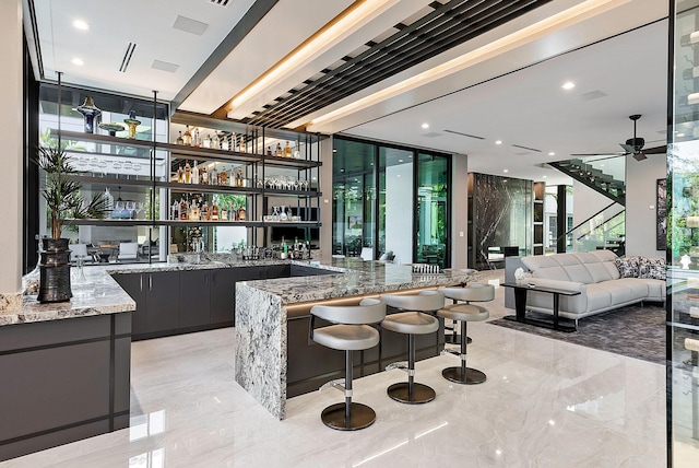 372 E Alexander Palm Rd, Boca Raton, FL 33432 - bar featuring indoor wet bar, marble finish floor, and a wealth of natural light