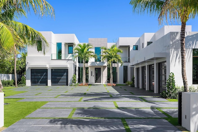 372 E Alexander Palm Rd, Boca Raton, FL 33432 - view of front of house featuring stucco siding and an attached garage