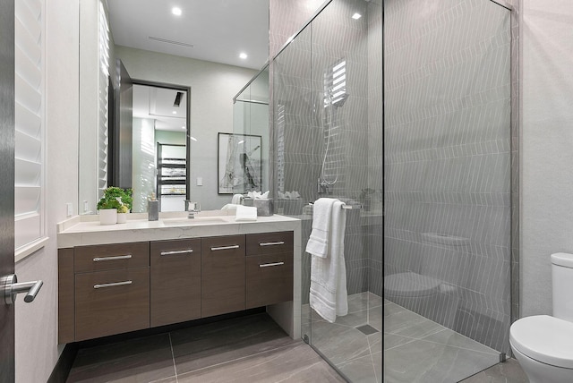372 E Alexander Palm Rd, Boca Raton, FL 33432 - bathroom with a walk in shower, vanity, visible vents, and toilet