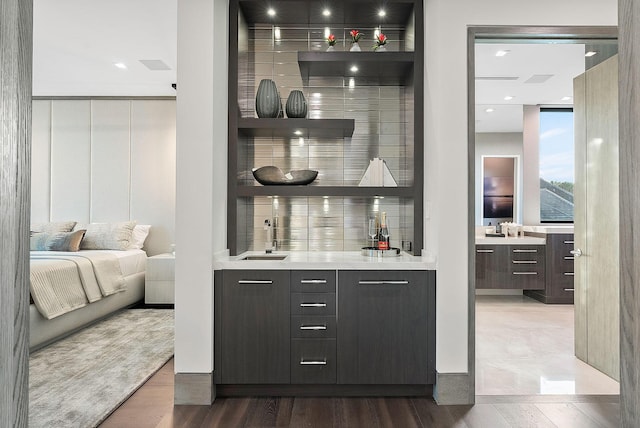 372 E Alexander Palm Rd, Boca Raton, FL 33432 - bar featuring indoor wet bar, tasteful backsplash, a sink, and dark wood-style floors