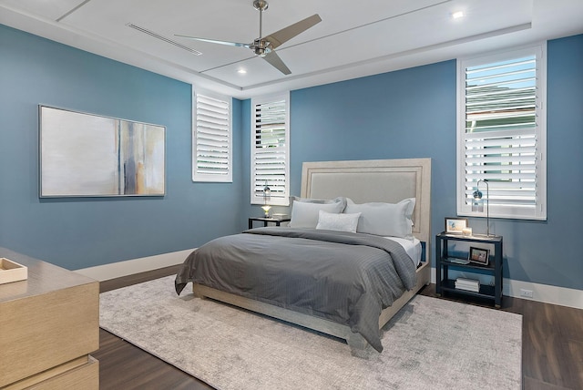 372 E Alexander Palm Rd, Boca Raton, FL 33432 - bedroom featuring recessed lighting, a tray ceiling, baseboards, and wood finished floors