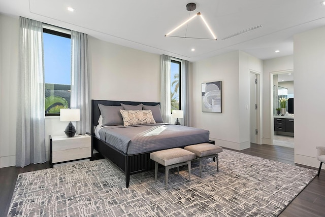 372 E Alexander Palm Rd, Boca Raton, FL 33432 - bedroom with baseboards, recessed lighting, connected bathroom, visible vents, and wood finished floors