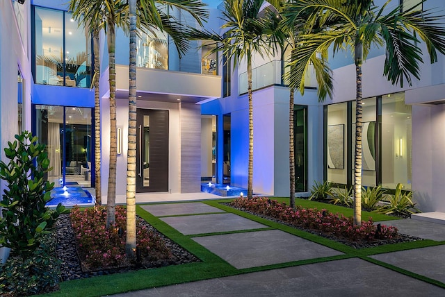 372 E Alexander Palm Rd, Boca Raton, FL 33432 - view of exterior entry with stucco siding