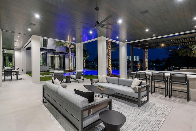 372 E Alexander Palm Rd, Boca Raton, FL 33432 - patio at twilight with outdoor lounge area, an outdoor pool, outdoor dining space, and ceiling fan