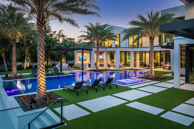 372 E Alexander Palm Rd, Boca Raton, FL 33432 - pool at dusk with a yard, a patio area, and an infinity pool