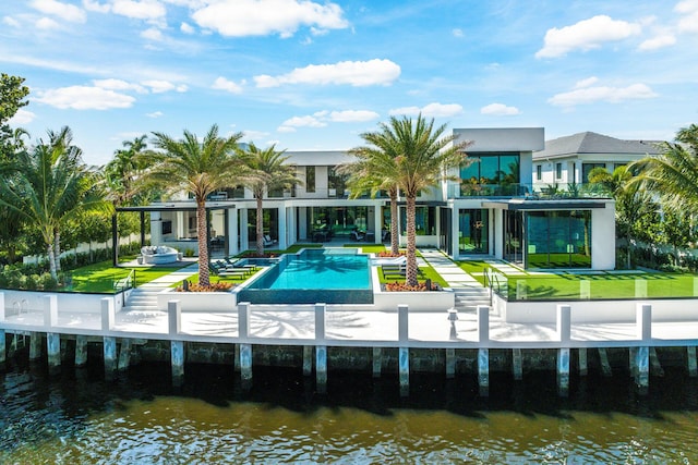 372 E Alexander Palm Rd, Boca Raton, FL 33432 - rear view of property with stucco siding, a lawn, a water view, a patio area, and an outdoor pool