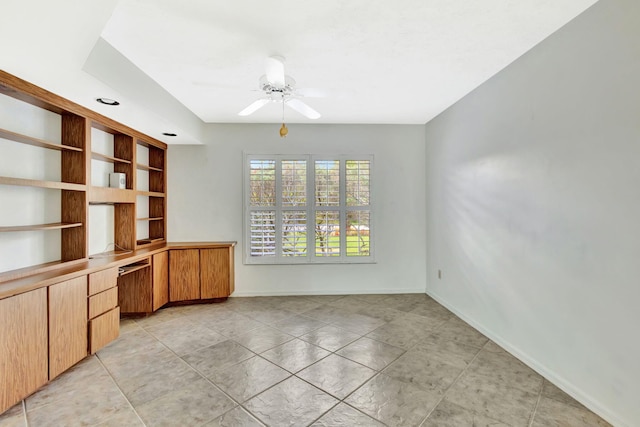 2101 SE Harlow St, Port Saint Lucie, FL 34952 - unfurnished office with baseboards, light tile patterned floors, ceiling fan, and built in study area