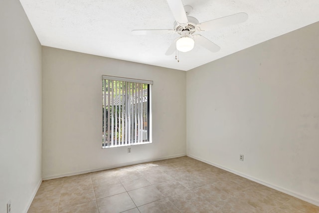 2101 SE Harlow St, Port Saint Lucie, FL 34952 - unfurnished room featuring light tile patterned floors, ceiling fan, and baseboards