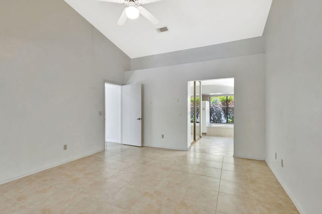 2101 SE Harlow St, Port Saint Lucie, FL 34952 - empty room featuring light tile patterned floors, visible vents, baseboards, a ceiling fan, and high vaulted ceiling