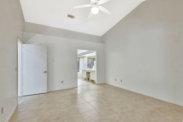2101 SE Harlow St, Port Saint Lucie, FL 34952 - empty room featuring light tile patterned flooring, high vaulted ceiling, a ceiling fan, visible vents, and baseboards