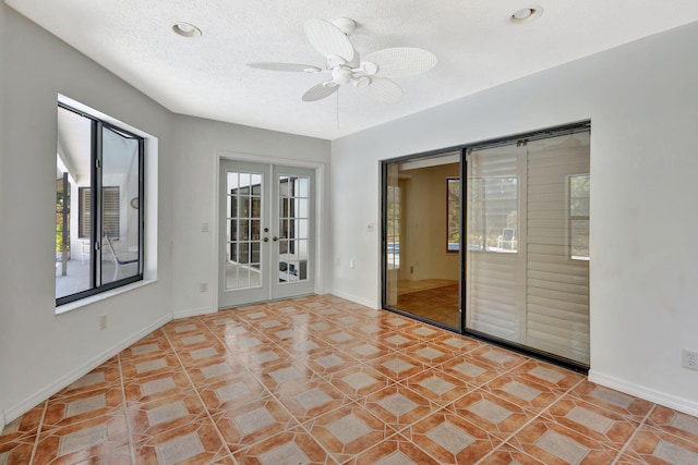 2101 SE Harlow St, Port Saint Lucie, FL 34952 - unfurnished room featuring recessed lighting, ceiling fan, baseboards, a textured ceiling, and french doors