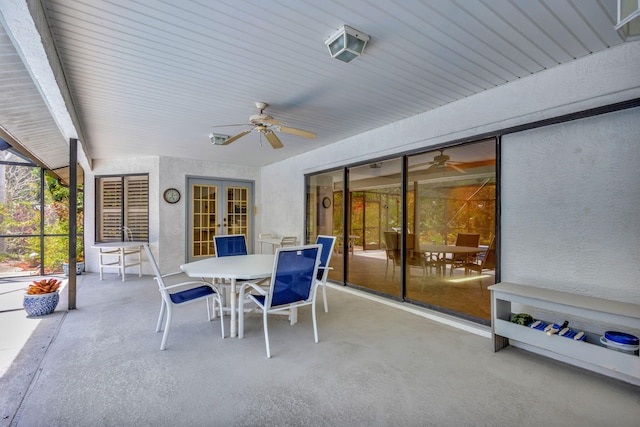 2101 SE Harlow St, Port Saint Lucie, FL 34952 - view of patio featuring outdoor dining area, ceiling fan, and french doors