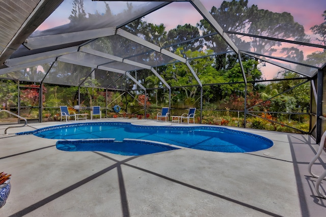 2101 SE Harlow St, Port Saint Lucie, FL 34952 - outdoor pool featuring a patio area and glass enclosure