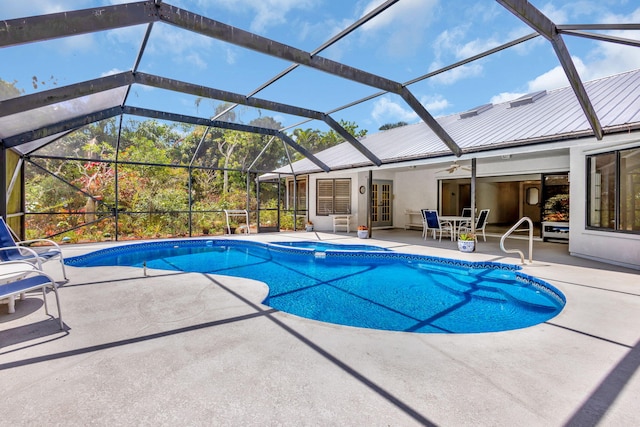 2101 SE Harlow St, Port Saint Lucie, FL 34952 - outdoor pool featuring french doors, an in ground hot tub, a patio area, a lanai, and a ceiling fan