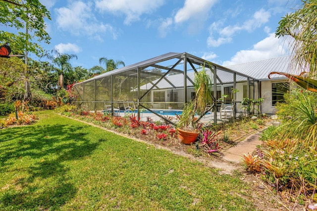 2101 SE Harlow St, Port Saint Lucie, FL 34952 - exterior space featuring glass enclosure and a yard